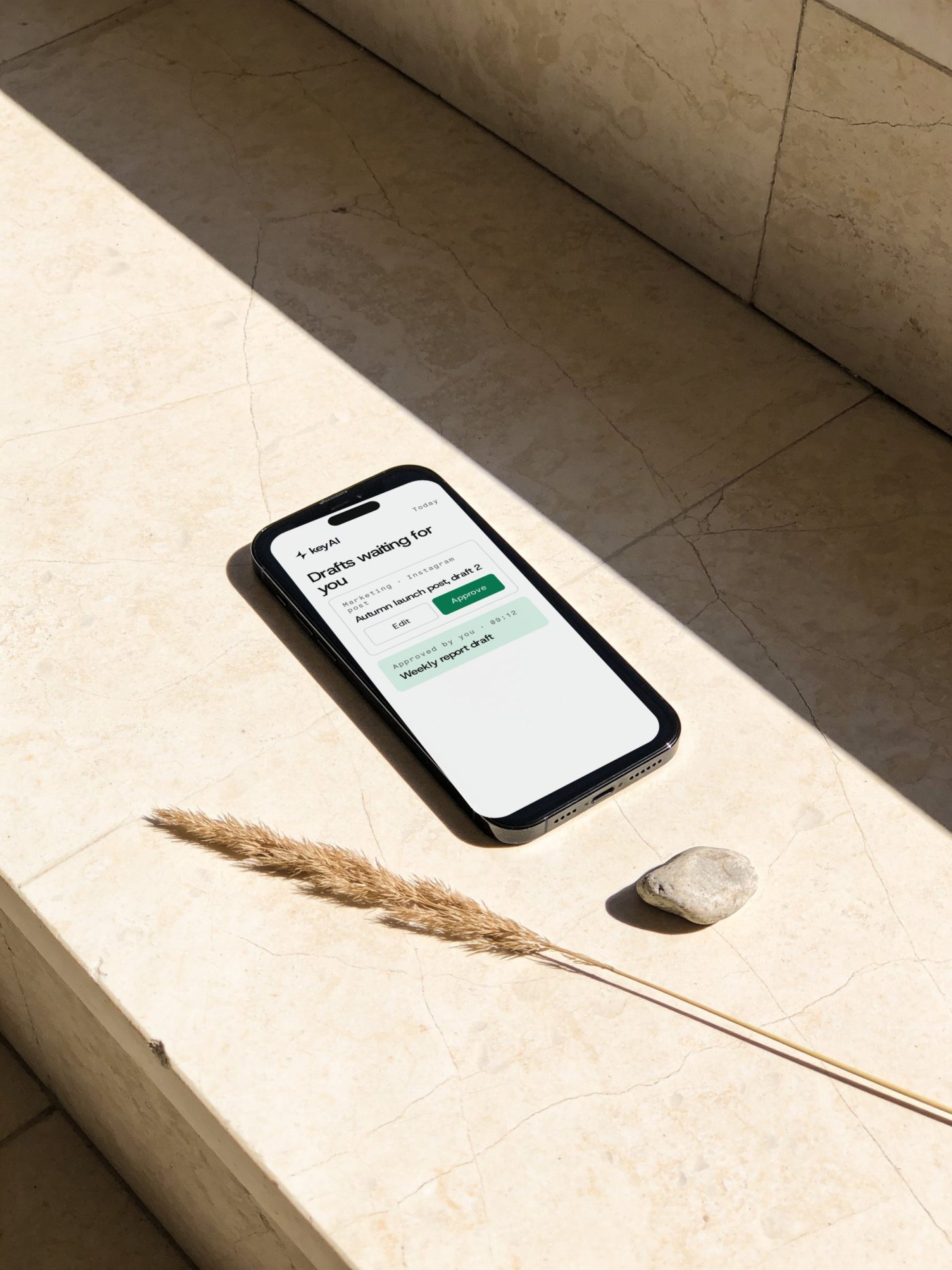Phone on travertine showing the keyAI approval screen